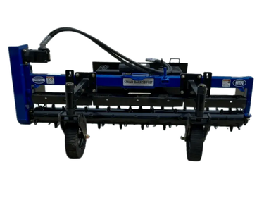 A close-up photo of the front of an MTW power rake, showing its blue and black paint, black wheels, and rake teeth.